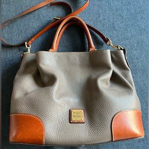 Brown leather Dooney & Bourke purse and matching wallet. Good used condition.